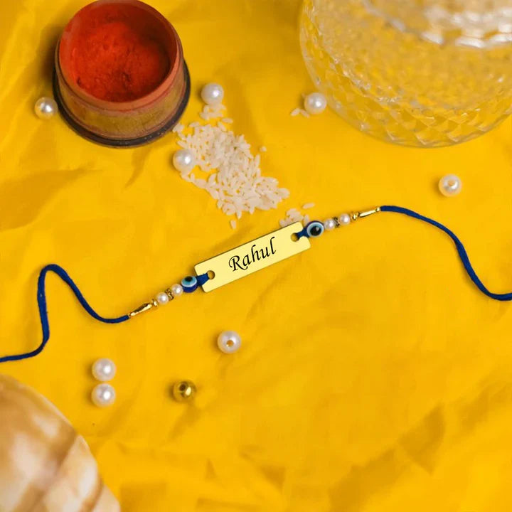 Customised Golden Name Rakhi With Evil Eye
